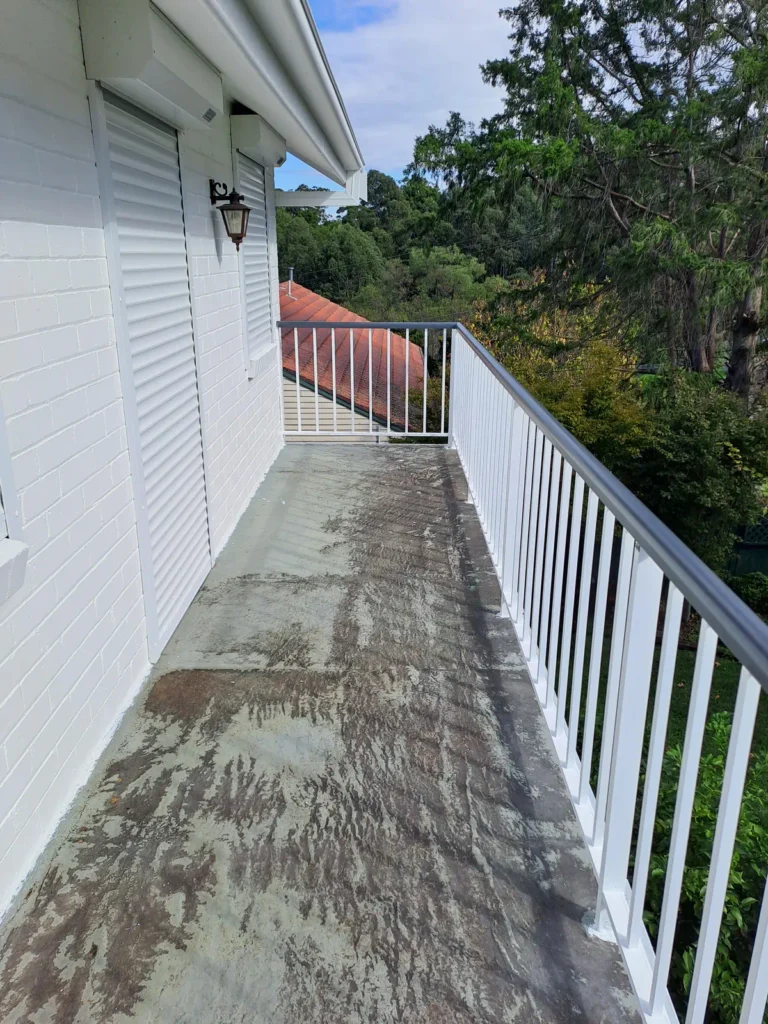 Balcony floor and railings before wash, prep and paint