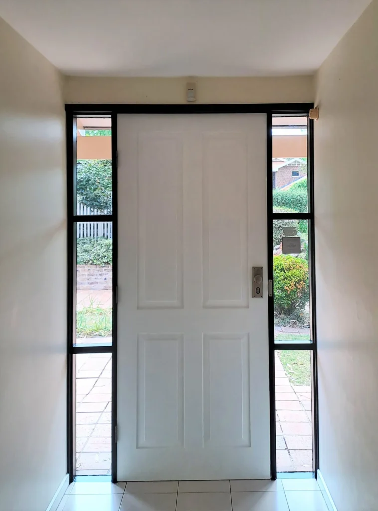 Black interior entry door frame with white door