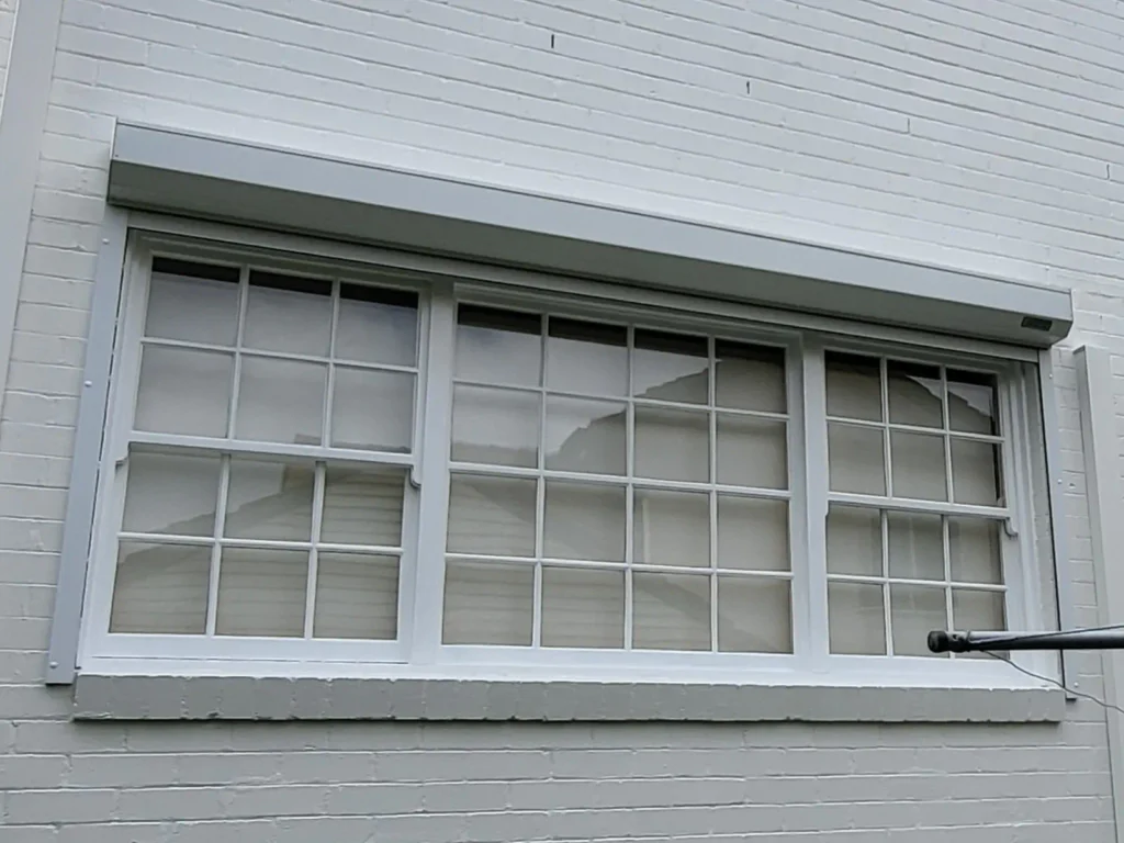 Colonial-style window after professional painting