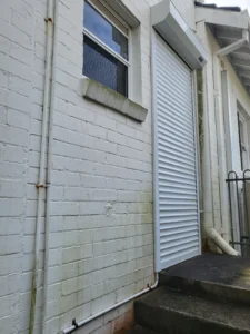 Exterior brick wall before painting by house painters in Sydney