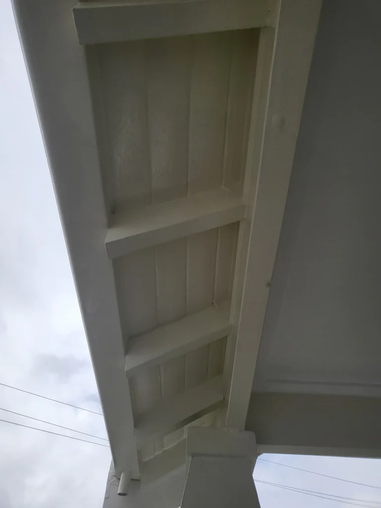 Eastwood home soffits and rafters after filling and painting