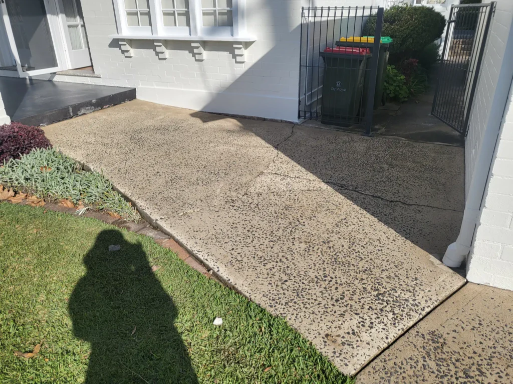 Cleaned house pathway after pressure washing