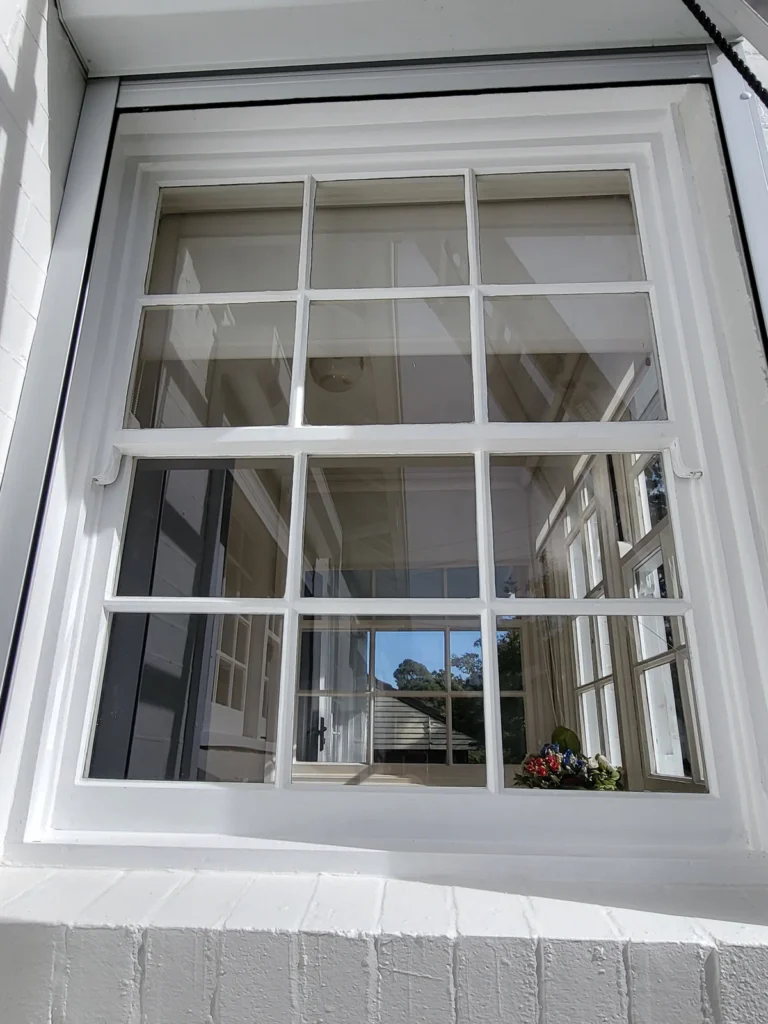 Sliding colonial grid window after fresh coats of paint